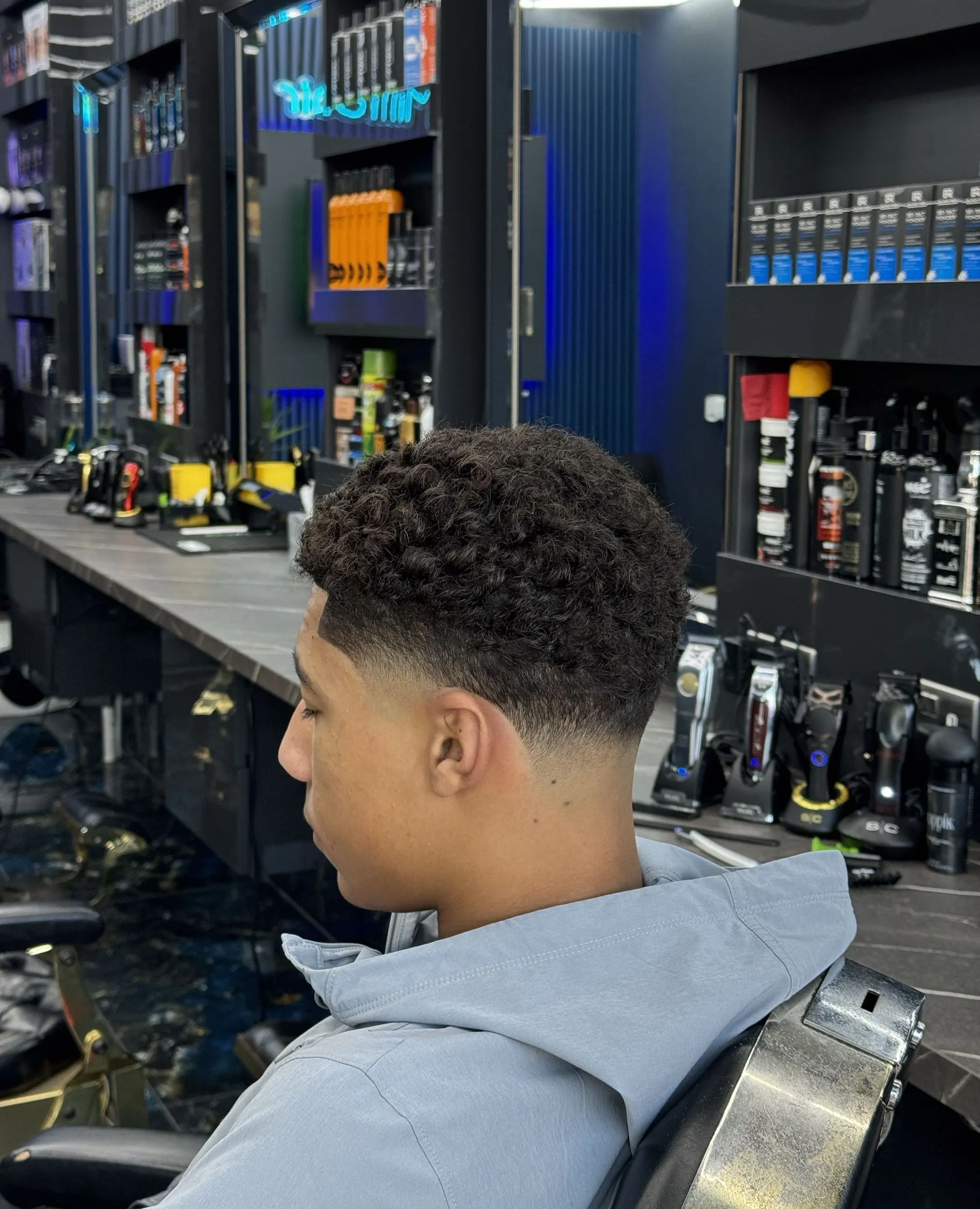 A taper fade finished against the shop window