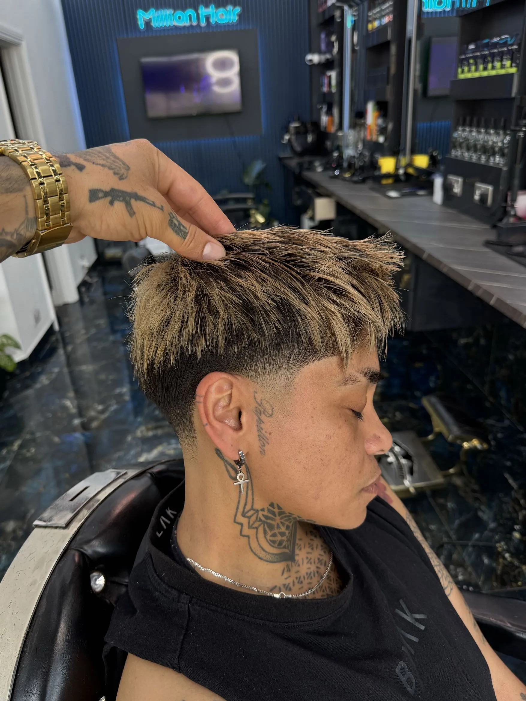 A textured crop with a taper fade, finished in the chair